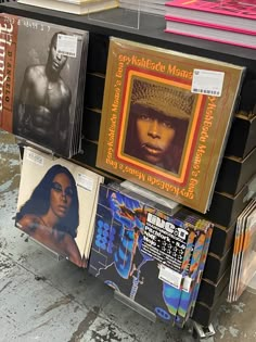 there are many records on the shelf in this store that is selling them for sale