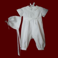 Perfect christening ensemble for an Irish baby boy, this exquisite Belfast's Best pure Irish linen romper with detachable gown has an embroidered knotted Celtic cross w/Halo with radiating pintucks and embroidered shamrocks & Irish claddagh on the pleated gown front.Entredeux, pintucks and folded tucks highlight the front yoke, sleeves and collar on the one piece romper with tiny shamrock appliques on the bodice. Romper is fully lined in 100% cotton. Back yoke has a double row of buttons to adju Detachable Gown, Baby Boy Gowns, Boy Monogram, Irish Baby, Pleated Gown, Boy Christening, Girl Christening, Linen Romper, Long Sleeve And Shorts