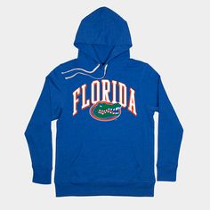 We took the classic, arched “Florida” from their 1986-87 basketball uniforms and combined it with one of the most well-known logos in sports. The scowling gator head wasn’t in official use until 1994, but soon after, Florida’s hoops fortunes would skyrocket. Products are mocked up on a size S. Graphics may appear smaller on larger sizes. Collegiate Team-colored Hoodie For Game Day, Throwback Team-colored Hoodie For Game Day, Collegiate Hoodie In Team Colors For Game Day, Collegiate Top With Drawstring Hood For Sports Season, Collegiate Tops With Drawstring Hood For Sports Events, Throwback Team-colored Hoodie For Fan Gear, Fan Merchandise Drawstring Hood Top, Collegiate Team-colored Hoodie For Fan Gear, Collegiate Sports Hoodie With Team Logo