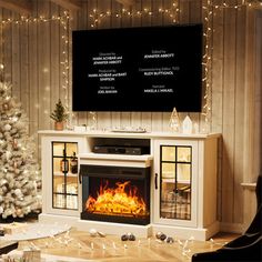 a living room decorated for christmas with a fireplace and tv on the wall above it