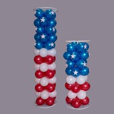 two tall red, white and blue balloons with stars on them