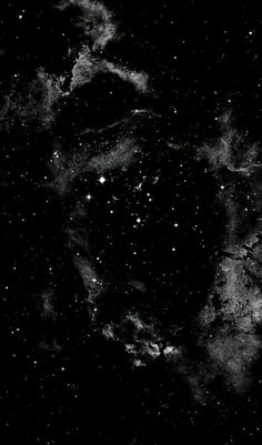 black and white photograph of the night sky with stars in it, as seen from space