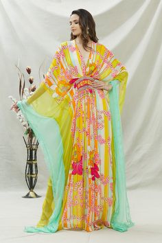 Olive green, multi color kaftan with floral print and embroidery on the waist.
Components:1
Pattern:Print and Embroidery
Type of Work:Floral Print, Thread and Beads
Neckline:V neck
Sleeve Length:Kaftan Sleeves
Fabric:Habutai Silk
Color:Green,Multi Color
Other Details:
Lace trim on the border
Bead tassels
Note: Inner worn by the model is not for sale
Occasion:Resort - Aza Fashions Anarkali Style Maxi Kaftan For Spring, Multicolor Kaftan With Dupatta For Wedding, Multicolor Georgette Dress With Dabka, Multicolor Georgette Dabka Dress, Multicolor Georgette Dress With Dabka Embroidery, Anarkali Multicolor Kaftan For Wedding, Traditional Yellow Kaftan With Floral Print, Festive Floral Print Maxi Kaftan, Green Bollywood Style Maxi Length Kaftan