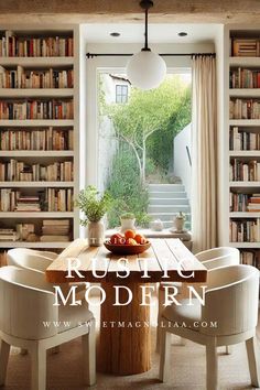 a dining room table with chairs and bookshelves full of books in the background