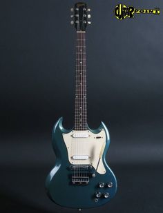 an electric guitar sitting on top of a table