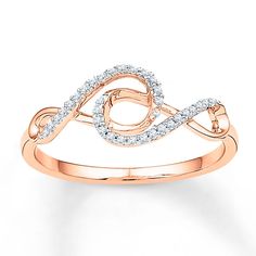 Two infinity symbols styled in 10K rose gold interlink in this contemporary ring for her. Round diamonds, totaling 1/10 carat in weight, add shine to complete the look. Infinite Ring, Unique Diamond Wedding Rings, Double Infinity, Pink Engagement Ring, Pink Sapphire Ring Engagement, Jewelry Advice, Contemporary Ring, Diamond Jewelry Designs, Infinity Ring