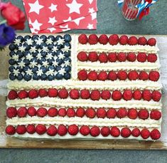 an american flag cake with strawberries on it