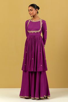 Purple peplum kurta in cotton base with floral hand embroidery. Comes with gharara and dupatta.
Component: 3
Pattern: Hand Embroidered
Type Of Work: Floral Pattern
Neckline: Round
Sleeve Type: Three Quarter
Fabric: Cotton
Color: Purple
Other Details: 
Gathered details
Embroidered border dupatta
Occasion: Mehendi and Haldi - Aza Fashions Designer Mulmul Palazzo Set With Resham Embroidery, Designer Floor-length Sharara With Resham Embroidery, Anarkali Sharara With Straight Kurta In Chinon, Bollywood Cotton Palazzo Set For Wedding, Bollywood Style Wedding Cotton Palazzo Set, Designer Chikankari Embroidery Choli Straight Kurta, Designer Wear Embroidered Floor-length Sharara, Floor-length Cotton Anarkali Set With Resham Embroidery, Designer Long Sleeve Sharara In Mulmul