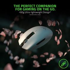 a computer mouse flying through the air with pink petals around it and text that reads, the perfect companion for gaming on the go