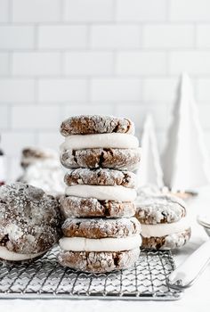 a stack of doughnuts sitting on top of a cooling rack