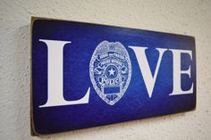 a blue police sign with the word love on it