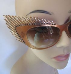 "Stunning Mardi Gras style vintage fantasy eyewear sunglasses. Handcrafted beauties like this are rare and highly collectible, one of a kind, hand painted. Coppery brown frames, carved eyelashes and smoked plastic lens. Art Deco feathers fan out into winged cat eye. Sparklies and clear faceted rhinestones dot eyelashes. Mikli Paris Hand Made in France #029633/ Lens measures 2-1/2\"/6.5cm x 1-1/2\"/4cm , temple 5-1/4\"/13.5cm, total width of glasses 9-1/4\"/23-1/2cm, total height 3\"/7-1/2cm. Con Paris Cat, Winged Cat, Cat Eye Lash, Jensen Beach, Alain Mikli, Stylish Eyeglasses, Feather Fan, Fashion Eye Glasses, France Art