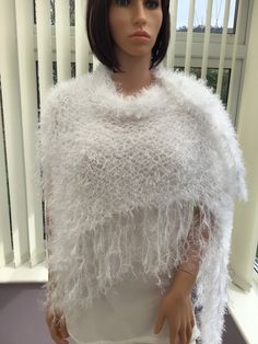 "This ice white shawl really is a knockout! It's elegant, glamorous & romantic, with a subtle lurex sparkle. It would be stunning as a bridal wedding shawl, a theatre trip, date night, etc, & really is a show stopper accessory. White will complement any colour too.  Hand wash at 30 degrees, dry flat Approx size - from top to point, 64cm (25\") x 190cm (75\") across at the widest point. 75% polyester, 25% lurex I have been established for several years, & have won awards for my scarves, as they a White Shawl, Bridal Shawl, Wedding Shawl, Shawl Wrap, Shawls And Wraps, Pure White, Evening Wear, Wedding Bridal, To My Daughter