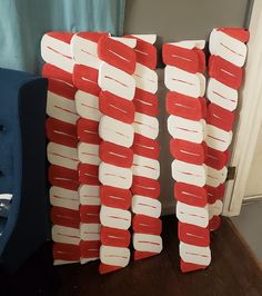 two red and white pieces of cardboard stacked on top of each other