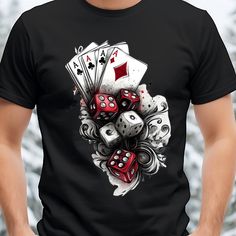 a man wearing a black t - shirt with playing cards and dices on it