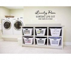 a washer and dryer sitting next to each other in a room with white walls