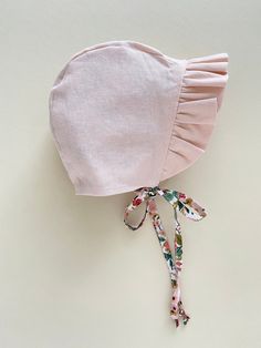 "ruffled floral baby bonnet girl / reversible ruffle bonnet / baby sunbonnet / baby sun hat / rifle paper co baby bonnet Made to Order This reversible ruffle bonnet is made from 100% cotton Rifle Paper Co floral fabric. It is lined with a peachy pink linen blend and has a sweet ruffle to frame your baby's face. You can also check out our Ready to Ship section for bonnets that ship in 1-2 business days https://www.etsy.com/shop/willowandhazel?ref=seller-platform-mcnav&section_id=17440954 Due Whimsical Cotton Hats For Spring, Cute Pink Bonnet For Spring, Cute Pink Bonnet With Curved Brim, Fitted Ruffle Hats For Spring, Fitted Spring Hat With Ruffles, Cute Pink Cotton Bonnet, Fitted Ruffled Hats For Spring, Spring Fitted Hats With Ruffles, Cute Adjustable Bonnet For Summer