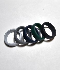 8mm Silicone rubber wedding ring / band. 8mm width with thicker band - ideal for men Available in size 7 to 14 Ideal ring for active lifestyles  As silicone is flexible and moulds to any shape - they can make an ideal ring for active lifestyle or someone who does a lot of work with there hand. Want to keep your normal wedding band safe when you workout or go swimming - but don't want to go out without a ring Worried about bending or catching your ring on machinery - no issues with a silicon ring Silicon Ring, Ring Band For Men, Rubber Rings Wedding, Silicone Rings, Wolfram, Minerals And Gemstones, Wood Rings, Ring Band, Silicone Rubber