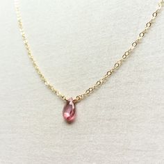 This is a pink Topaz necklace made of genuine high quality faceted Pink Topaz. This dainty necklace is great for layering with other gold necklaces. Measurement: 8 mm by 6 mm S for Sparkle on Etsy https://www.etsy.com/shop/sforsparkleshop -------------------------------------------------------------------- S for Sparkle Mission We believe that everyone should have the power and access to practice self-validation. We strive to empower people with reminders of their inner values and worthiness thr Pink Dainty Pendant Crystal Necklace, Pink Dainty Crystal Pendant Necklace, Dainty Pink Crystal Pendant Necklace, Pink Faceted Necklace For Gift, Dainty Crystal Necklaces With Faceted Beads For Gift, Dainty Crystal Necklace With Faceted Beads As Gift, Dainty Pink Drop Jewelry, Pink Teardrop Pendant Necklace In Dainty Style, Pink Gemstone Briolette Necklace