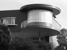 a black and white photo of a round building