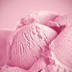 pink ice cream in a bowl on a table