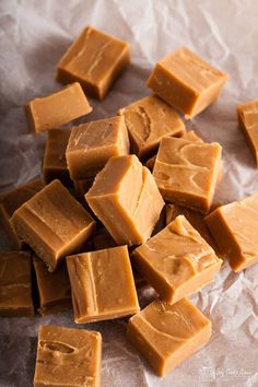 pieces of peanut butter fudge sitting on wax paper