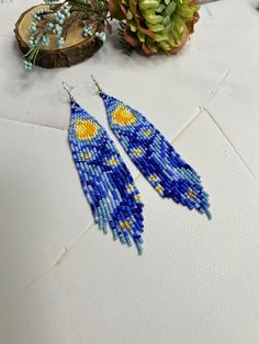 Long earrings in the style of Van Gogh. Made from Czech beads. Length 6 inches(15cm). Width 1.1 inches(3cm). Hypoallergenic clasp. >Back to my shop: https://www.etsy.com/shop/jewelrybylarisa?ref=seller-platform-mcnav Handmade Artistic Beaded Earrings, Handmade Artistic Earrings With Round Beads, Artistic Handmade Earrings With Round Beads, Handmade Celestial Earrings For Festivals, Blue Beaded Earrings With Colorful Beads As Gift, Artistic Beaded Dangle Earrings With Ear Wire, Artsy Blue Beaded Dangle Earrings, Artsy Multicolor Beaded Earrings, Artsy Blue Beaded Earrings