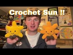 a boy holding two small stuffed animals in his hands with the caption crochet sun