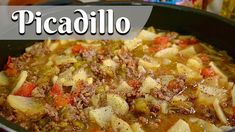 a pot filled with meat and vegetables on top of a stove