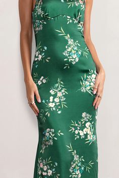 Look and feel utterly divine in our green floral print Grandeur halter neck maxi dress. Constructed in luxurious satin and with a cascading hemline, this stunning floor-sweeping gown is worthy of the red carpet. It's cut in a way that contours your curves beautifully – it cinches in at the waist and falls into an elegant fishtail shape, creating a gorgeous hourglass silhouette. This showstopping evening gown is essential for those special occasions. Red-carpet worthy!    Features  - Halter neckline  - Open back detail  - Floral print  - Premium satin fabric     Sizing & Fit   Model is 5’9 and wears UK size 8 / US size 4      Product Information      Slight stretch   Satin fabric (95% Polyester 5% Elastane)   Length from top of shoulder to hem: 157cm   SKU: CL126538 Satin Maxi Dress For Garden Party, Floor-length Green Maxi Dress With Floral Print, Green Floor-length Floral Maxi Dress, Green Satin Dress For Spring, Green Satin Dress For Garden Party, Green Satin Midi Dress For Summer, Fitted Green Floral Maxi Dress, Green Floral Print Satin Dress, Green Satin Dress With Floral Print