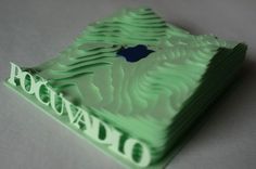 an apple logo is cut out of green paper