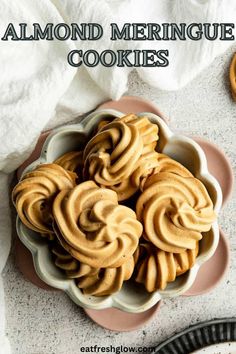 almond meringue cookies in a bowl on a plate with the title above it