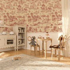 Vintage red toile de Jouy wallpaper with pastoral farm scenes in a cozy nursery room setup, featuring wooden children's furniture and toys. French Toile Wallpaper, Bohemian Wallpaper, French Wallpaper, Mountain Decal, Red Toile, Toile Wallpaper, Wallpaper Textured, Kids Room Decals, Red French