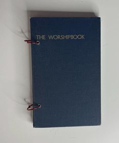 a blue book with the words the worshipbook written on it