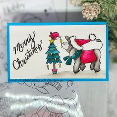 a handmade christmas card with an image of a poodle and a tree on it