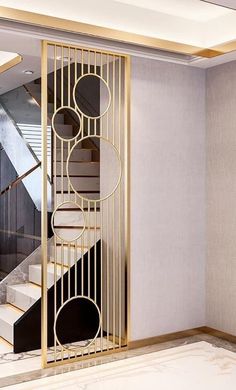 an elegant staircase with gold and black accents