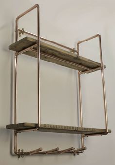 two metal shelvings are hanging on the wall