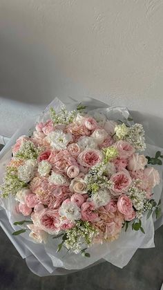 a large bouquet of pink and white flowers