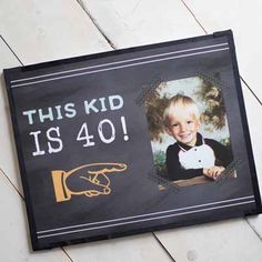 a sign that says this kid is 40 with a picture of a hand holding a mouse