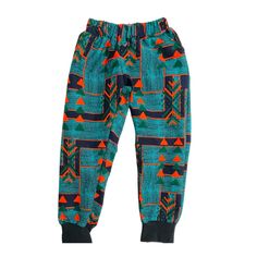 Soft comfortable pant in African print fabric  The pants have a no roll comfortable waistband, front pockets, and ribbed 'joggers style' ankles. Please check the sizing charts in the images, send me a message if you need custom sizing. Casual Blue Pants For Playwear, Blue Playwear Pants With Elastic Waistband, Blue Pants With Elastic Waistband For Playwear, Casual Multicolor Joggers With Elastic Waistband, Green Cotton Playwear Pants, Casual Cotton Joggers For Playwear, Unisex Cotton Casual Pants, Multicolor Playwear Bottoms With Elastic Waistband, Multicolor Bottoms With Elastic Waistband For Playwear