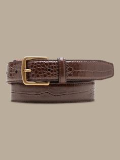 Sleek and streamlined, this embossed leather belt adds a bit of variety to your wardrobe.  LEATHER WORKING GROUP: By purchasing this product, you are supporting responsible leather manufacturing through the Leather Working Group.  Width: 1" (2. 5cm) Leather Belt With Removable Buckle For Semi-formal Occasions, Luxury Business Belt With Crocodile Pattern, Luxury Crocodile Pattern Belt For Business, Elegant Leather Belt With Crocodile Pattern, Elegant Fitted Belt For Business Casual, Classic Brown Belt Buckle For Office, Elegant Formal Belt Buckles With Crocodile Pattern, Elegant Formal Belt Buckle With Crocodile Pattern, Elegant Brown Belt For Business Casual