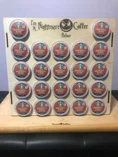 a display case with twelve cups of coffee on it