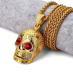 Height: 1.4" or 3.6cm Length: 0.9" or 2.5cm Certified Ruby 18K Gold Skull Pendant Comes with a Free 29.5" 18K Gold Plated Chain Jewelry plated with the latest technology available Guaranteed durability and quality, built using strong metal bases Perfect for all occasions, can be paired with all our chains Click add to cart in order to purchase! Gold Skull Necklace For Halloween, Gold Skull-shaped Engraved Jewelry, Halloween Skull Shaped Gold Jewelry, Hip Hop Chains, Hip Hop Necklace, Gold Skull, Red Diamond, Skull Necklace, Skull Pendant