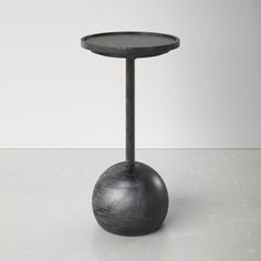 a small black table with a metal base