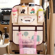 the back seat of a car filled with baby items