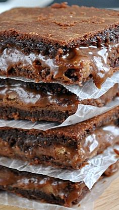 three chocolate brownies stacked on top of each other