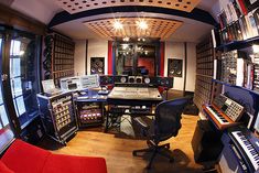 a recording studio with many electronic equipment