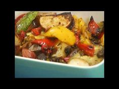 a bowl filled with vegetables and meat on top of a table