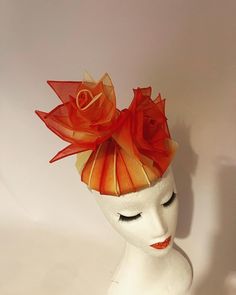 A unique piece of millinery featuring ombré hand dyed shades in Orange Red Yellow crisscrossing over the hat base with delicate flowers on top. All made of crisp lightweight cotton.  Perfect for Races, Weddings, and other special occasions where you want to stand out yet remain elegant and poised. Red Fitted Fascinator For Garden Party, Red Adjustable Fascinator For Garden Party, Red Summer Fascinator With Handmade Flowers, Adjustable Red Fascinator For Garden Party, Summer Red Fascinator With Handmade Flowers, Red Handmade Flowers Fascinator For Summer, Red Handmade Flowers Fascinator For Spring, Yellow Fascinator, Royal Ascot Hats