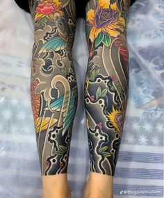 the legs and arms of a woman with tattoos on her body are covered in floral designs